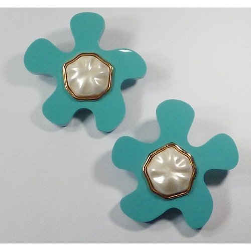 101 - A pair of Chanel clip-on earrings comprising oversized turquoise plastic irregular flower head motif... 