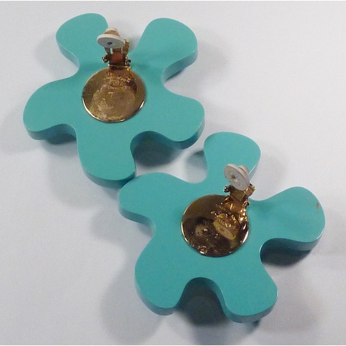101 - A pair of Chanel clip-on earrings comprising oversized turquoise plastic irregular flower head motif... 
