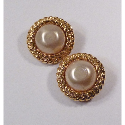 102 - A pair of Chanel clip-on earrings, comprising signed gilt base metal 
