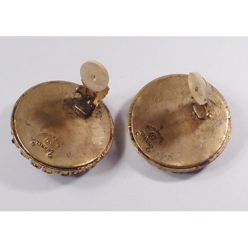 103 - A pair of Chanel clip-on earrings, comprising a cluster of paste stones set in signed gilt base meta... 