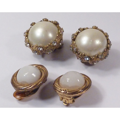 104 - Two pairs of Chanel clip-on earrings, both a/f settings having worn gilt plate, etc.  24mm and 21mm