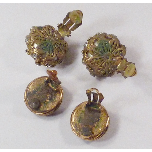 104 - Two pairs of Chanel clip-on earrings, both a/f settings having worn gilt plate, etc.  24mm and 21mm