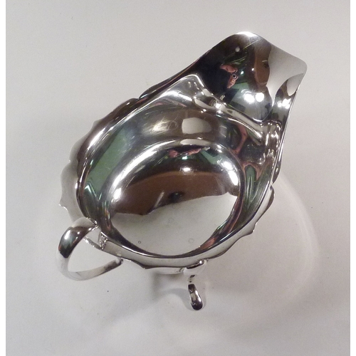 11 - A silver sauce boat, 20th cent.  145mm long / 100g