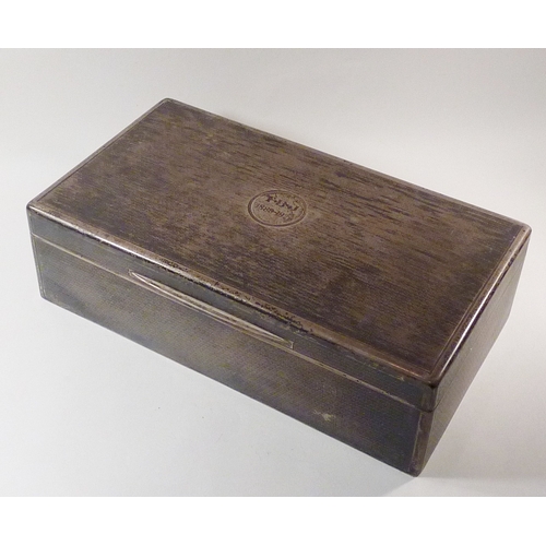 20 - A Mappin &  Webb cigarette box, silver having hardwood liner, engine turned decoration to exterior a... 
