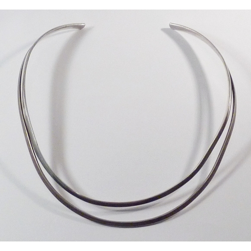 73 - A curve / torque chocker neck ring, white metal marked 925 in Scandinavian / Georg Jensen manner