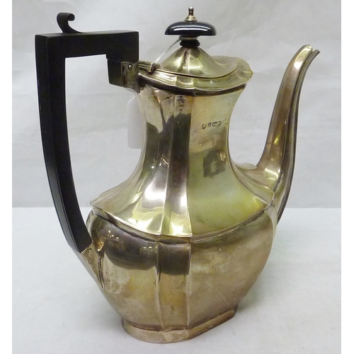 26 - A silver teapot, Walker & Hall, Sheffield 1931, 260mm long; a silver water jug.  1100g gross