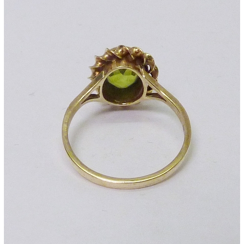 77 - A 9ct gold green citrine cocktail ring, a/f stone rubbed; two other cocktail rings, yellow metal.  A... 