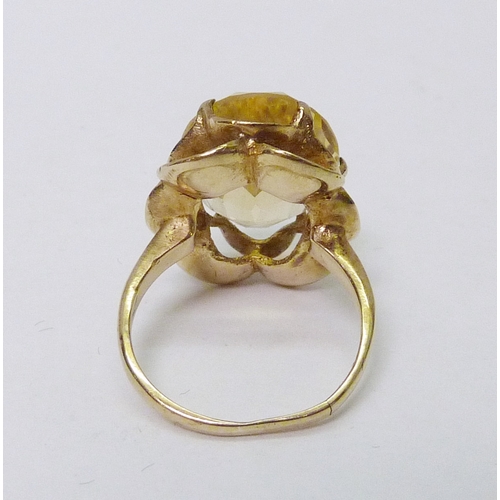 77 - A 9ct gold green citrine cocktail ring, a/f stone rubbed; two other cocktail rings, yellow metal.  A... 