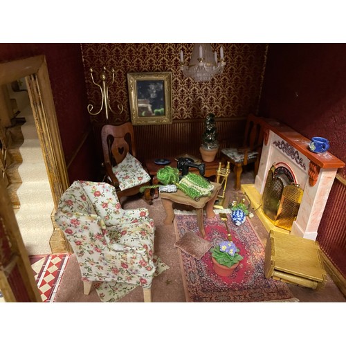 890 - A dolls house, 59cm wide together with furniture