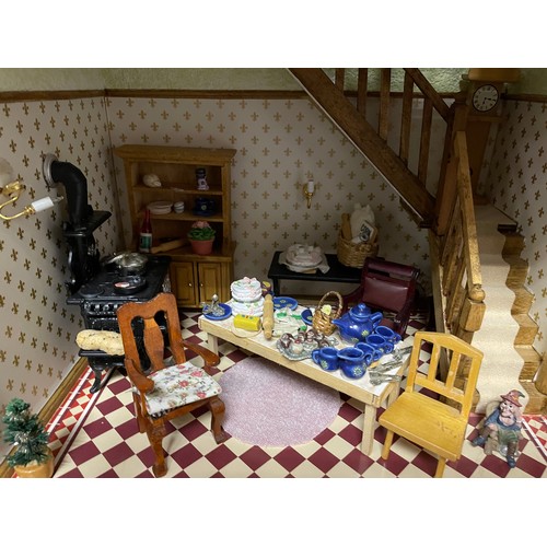 890 - A dolls house, 59cm wide together with furniture