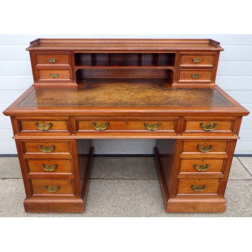 738 - A late Victorian/Edwardian walnut Dickens Desk with leather inset top, 138cm wide