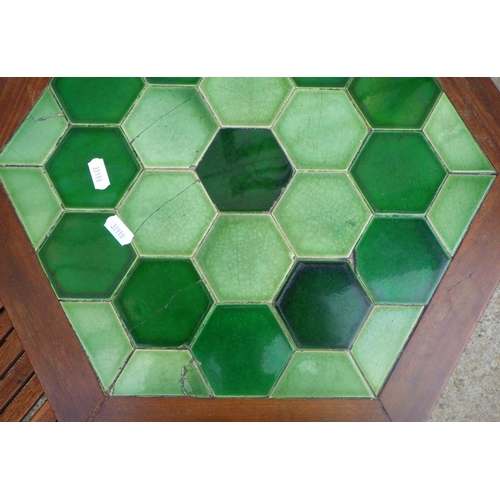 790 - A slatted chair together with a tile topped hexagonal occasional table, (a/f) (2)