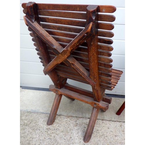 790 - A slatted chair together with a tile topped hexagonal occasional table, (a/f) (2)