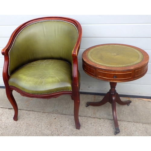 798 - A green leather upholstered tub chair together with a drum topped occasional table (2)