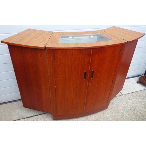 813 - A 1960's fold out teak bar, 83cm wide