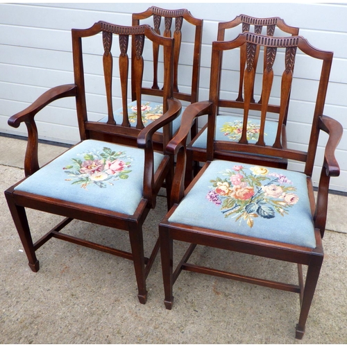 816 - A set of four Edwardian mahogany dining chairs with needlework seats, incl pair of carvers