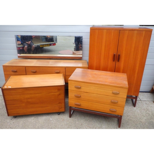 821 - A G.Plan, E.G teak dressing table, tallboy & chest, some fading, together with a teak blanket box (4... 