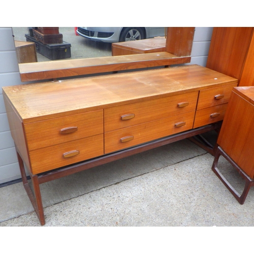 821 - A G.Plan, E.G teak dressing table, tallboy & chest, some fading, together with a teak blanket box (4... 