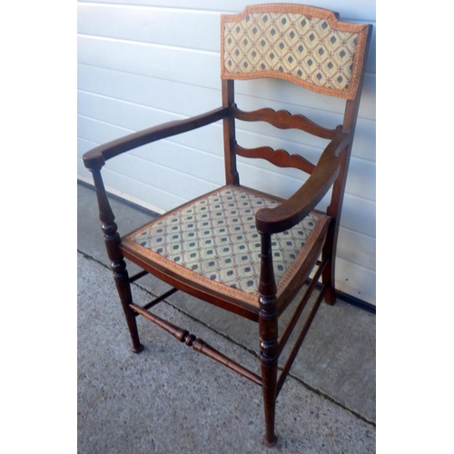 833 - An Edwardian salon armchair