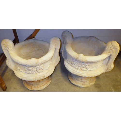 837 - A pair of two handled concrete garden planters 37cm across, not including handles