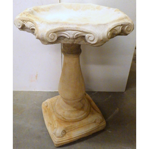 838 - A concrete bird bath with hexagonal top, 53cm across