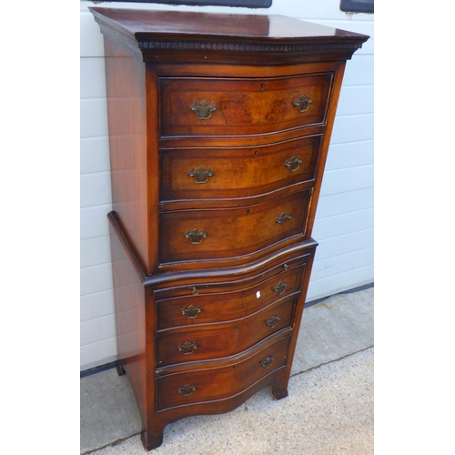 848 - A small walnut bowfronted chest on chest 63cm wide