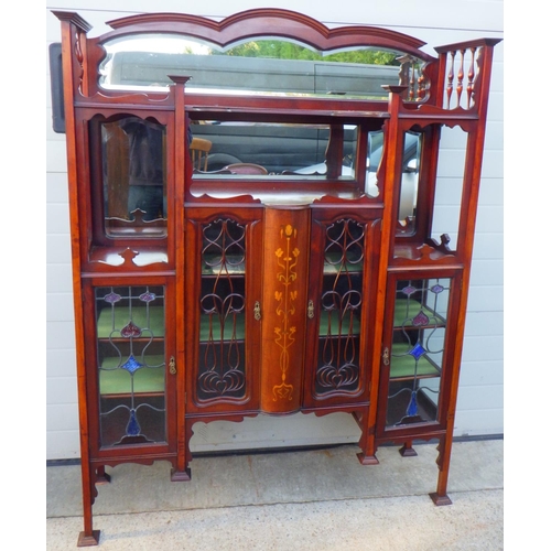 849 - An Edwardian, Art Nouveau inlaid side cabinet with leaded glass doors, top arched rail fractured, 14... 