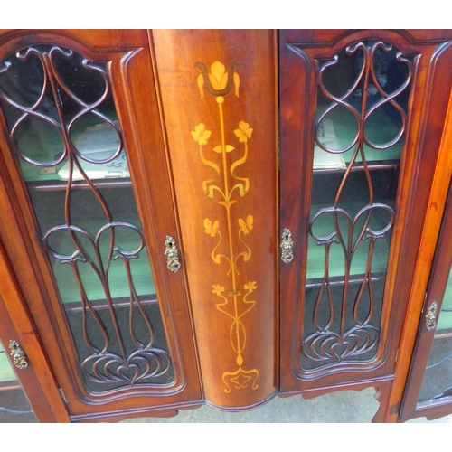 849 - An Edwardian, Art Nouveau inlaid side cabinet with leaded glass doors, top arched rail fractured, 14... 