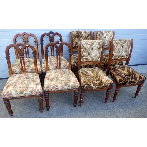 851 - A set of four Victorian oak dining chairs with gothic arched backs together with another set of four... 