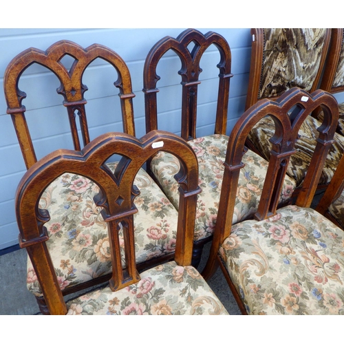 851 - A set of four Victorian oak dining chairs with gothic arched backs together with another set of four... 