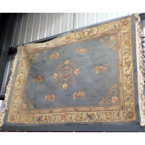 875 - A blue Chinese rug, (a/f moth damage), 255cm long