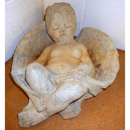 879 - A concrete sleeping cherub