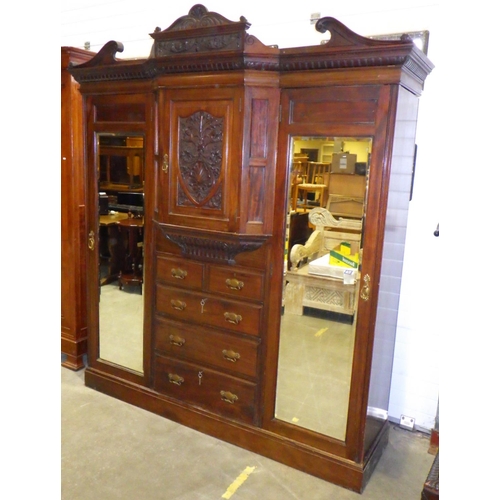 880 - An Edwardian walnut triple wardrobe with label Johnson & Appleyard, 206cm wide