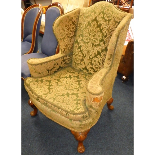 889 - A 1930's wingback armchair, upholstery a/f