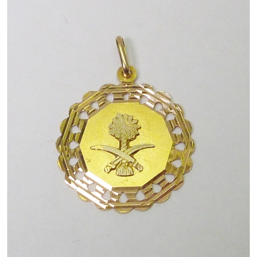 113 - An octagonal pendant having applied Saudi Arabian interest motif, yellow metal marked 750, 23mm acro... 