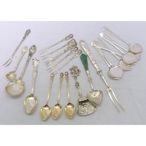 128 - Three German gilt white metal coffee spoons marked 800, each 108mm long; six matching continental wh... 