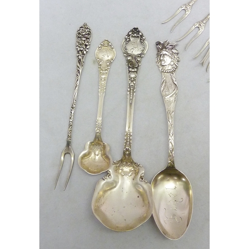 128 - Three German gilt white metal coffee spoons marked 800, each 108mm long; six matching continental wh... 