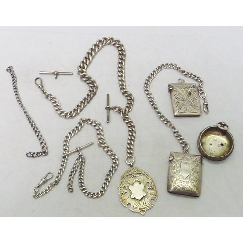 148 - A silver graduated watch chain having attached fob; other chains together with two silver vestas, et... 
