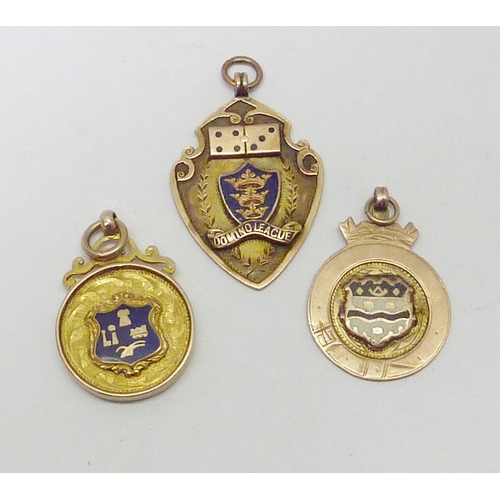 154 - Three 9ct gold fobs. 20g gross