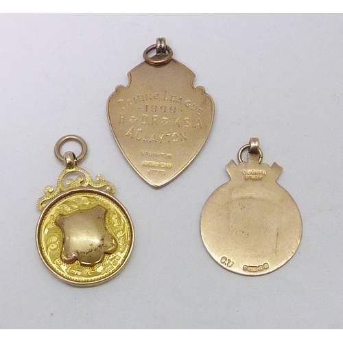 154 - Three 9ct gold fobs. 20g gross