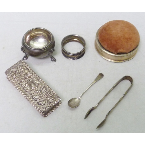 157 - An Edwardian silver trinket box having repousse design; a silver edged trinket box / pin cushion; ot... 
