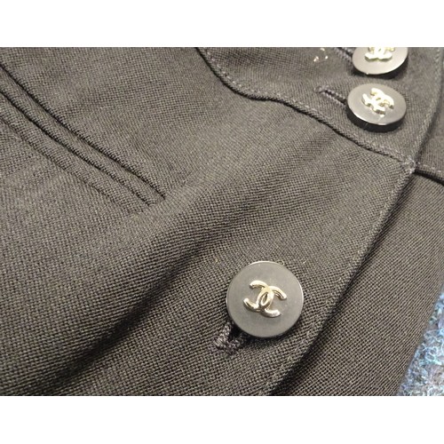 109 - A Chanel Boutique black wool suit skirt, 33cm across waistband top; a Prada ladies white silk jacket... 