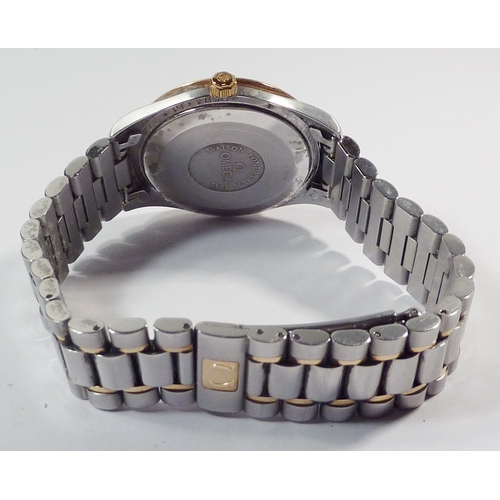 324 - An Omega bracelet watch having an Omega 1110 cal. automatic movement under a white dial in a steel c... 