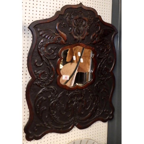 46 - A carved Green man style wall mirror 60 x 80cm