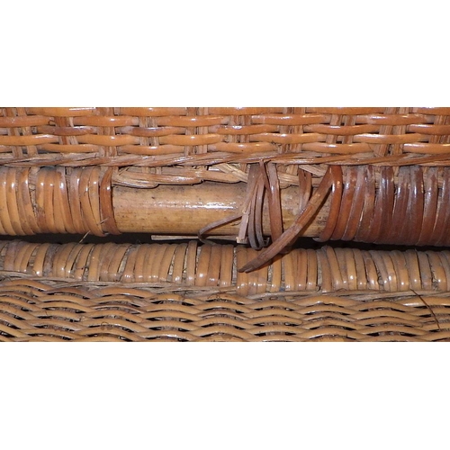 63 - A pair of vintage wicker fishing chairs, the folding backs held by leather straps, af