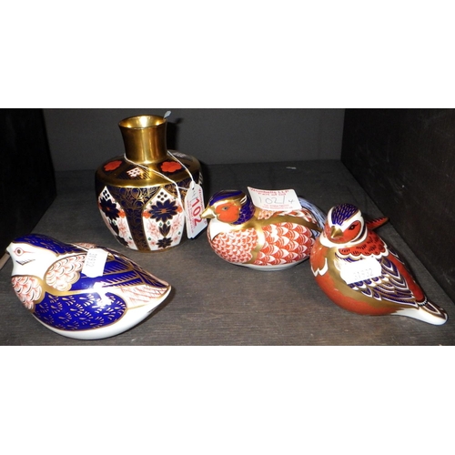 102 - A Crown Derby Imari vase together with three paper weights (all seconds)