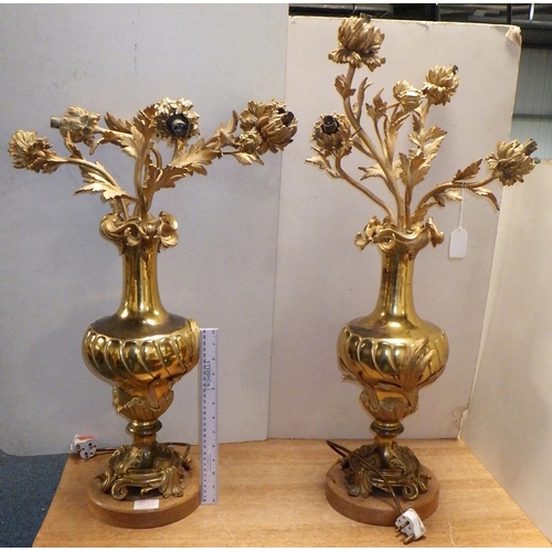 123 - A pair of large gilt heavy metal floral table Lamps 66 & 89cm tall