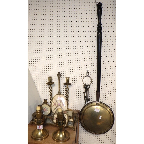 91 - A qty of mics brass ware to inc twisted candlesticks, bed warmer, dressing table set etc