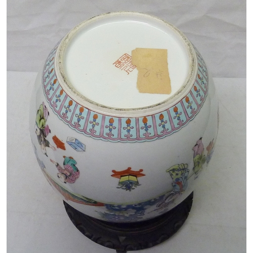 298 - A Chinese famille rose ginger jar decorated with scenes of children playing.  Approximately 23cm tal... 