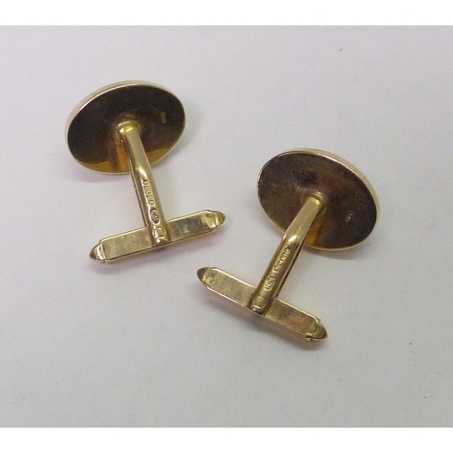 309 - A pair of swivel back cufflinks, 9ct gold inset with mother of pearl, Sheffield 1984.  Heads 17 x 12... 